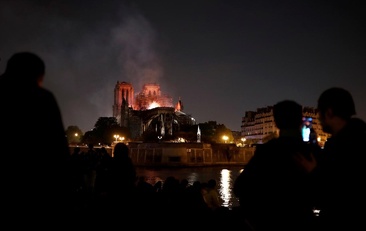 'City of lights' plunged into dark sorrow as Notre-Dame burns