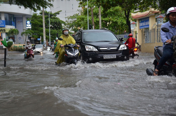 Downpour floods Ho Chi Minh City as rainy season begins