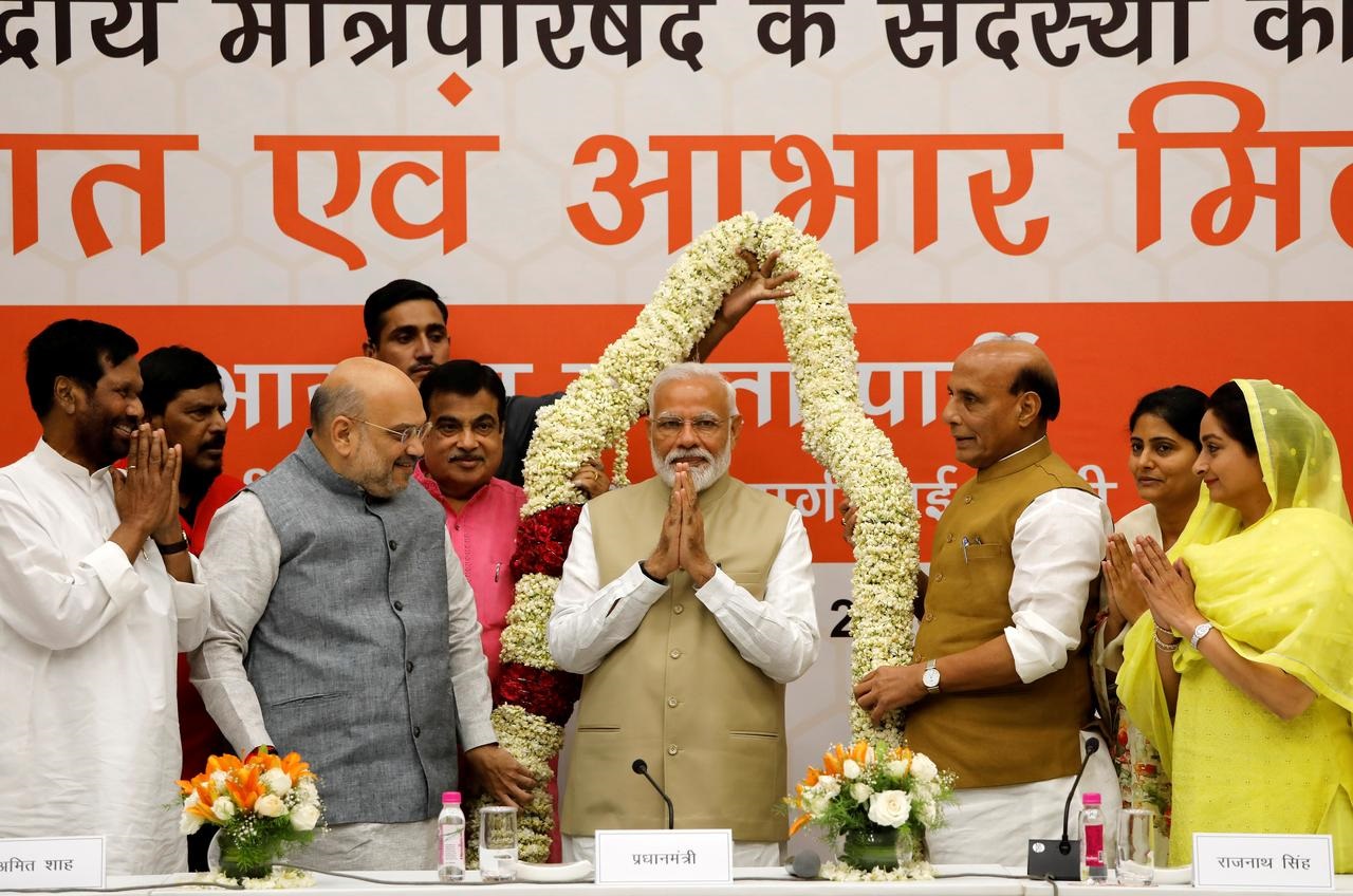 Confident of poll win, Modi's alliance promises to boost India's economy