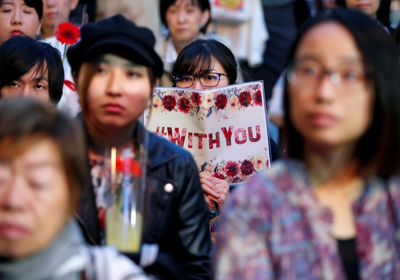 With flowers and personal stories, Japan sexual abuse survivors seek reform
