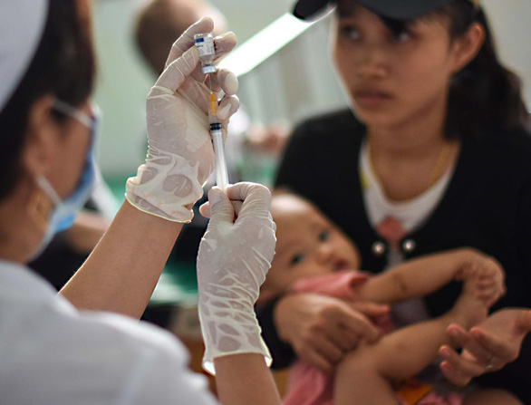 Roads may be rare in this Vietnamese commune, but immunization rate tops 97%