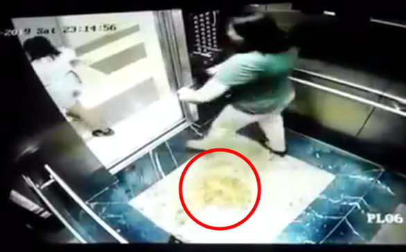 Vietnamese woman covers CCTV camera for friend to urinate in Hanoi elevator