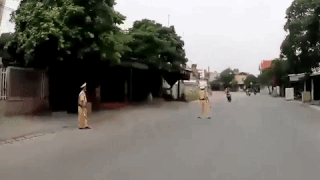 Vietnamese traffic police officer knocked over trying to stop speeding motorcyclist