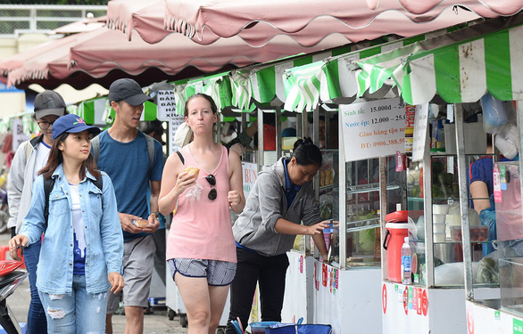 In Ho Chi Minh City, designated areas for street food sellers start to bear fruit