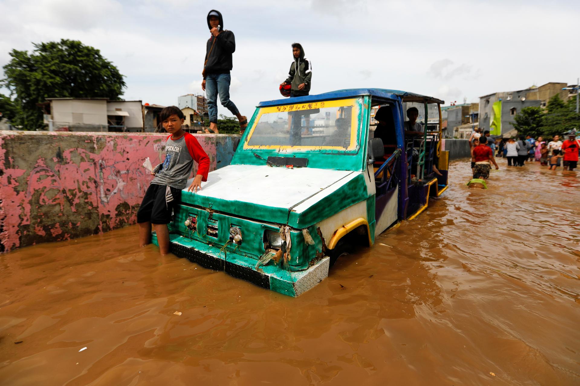 Indonesia plans cloud seeding to halt rain as floods death toll hits 30
