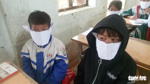 In rural Vietnam, students don DIY face masks made from notebook paper amid coronavirus scare
