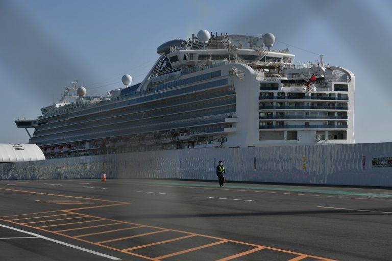 Japan says 23 passengers mistakenly left virus ship before testing