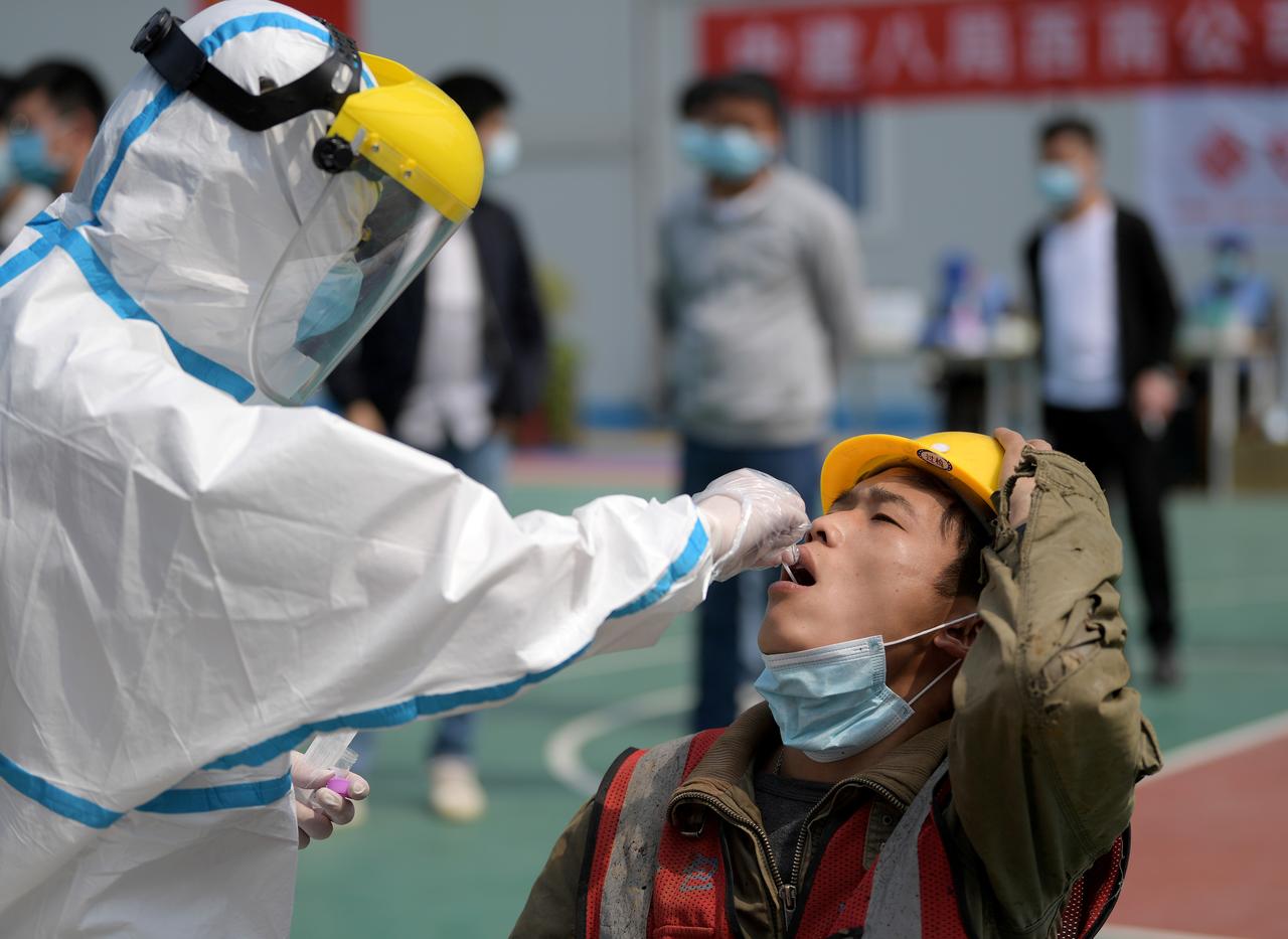 China says nearly 1,300 virus deaths not counted in Wuhan, cites early lapses