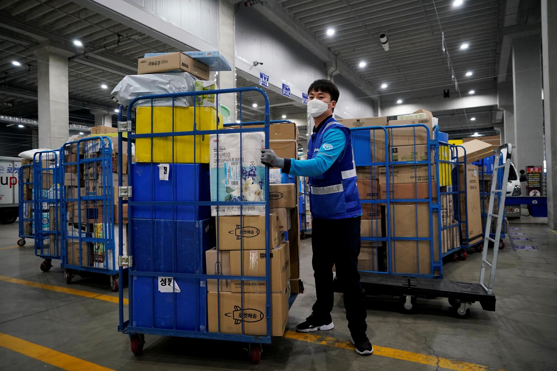 Coronavirus outbreak at South Korea e-commerce warehouse drives spike in new cases