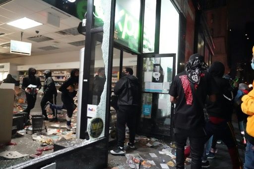 New York under curfew as looters hit luxury stores