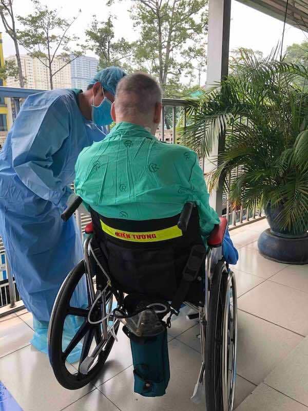 British pilot, already cleared of coronavirus, sunbathes in wheelchair at Vietnam hospital