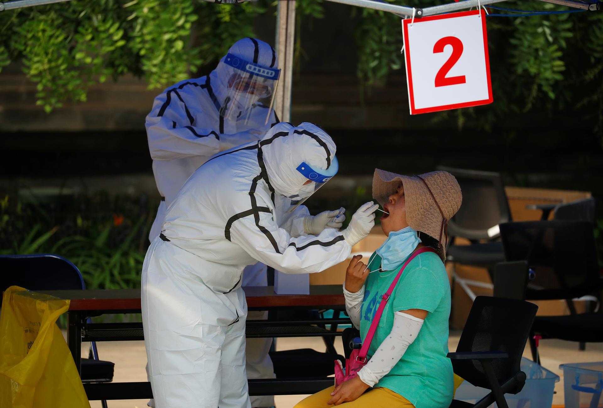 China reports 22 new coronavirus cases, 13 in Beijing