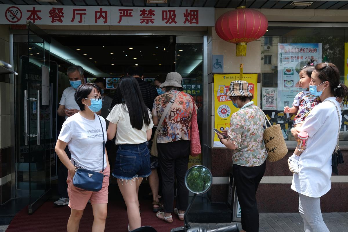 Six months after 'viral pneumonia', Wuhan returning to normal, with masks