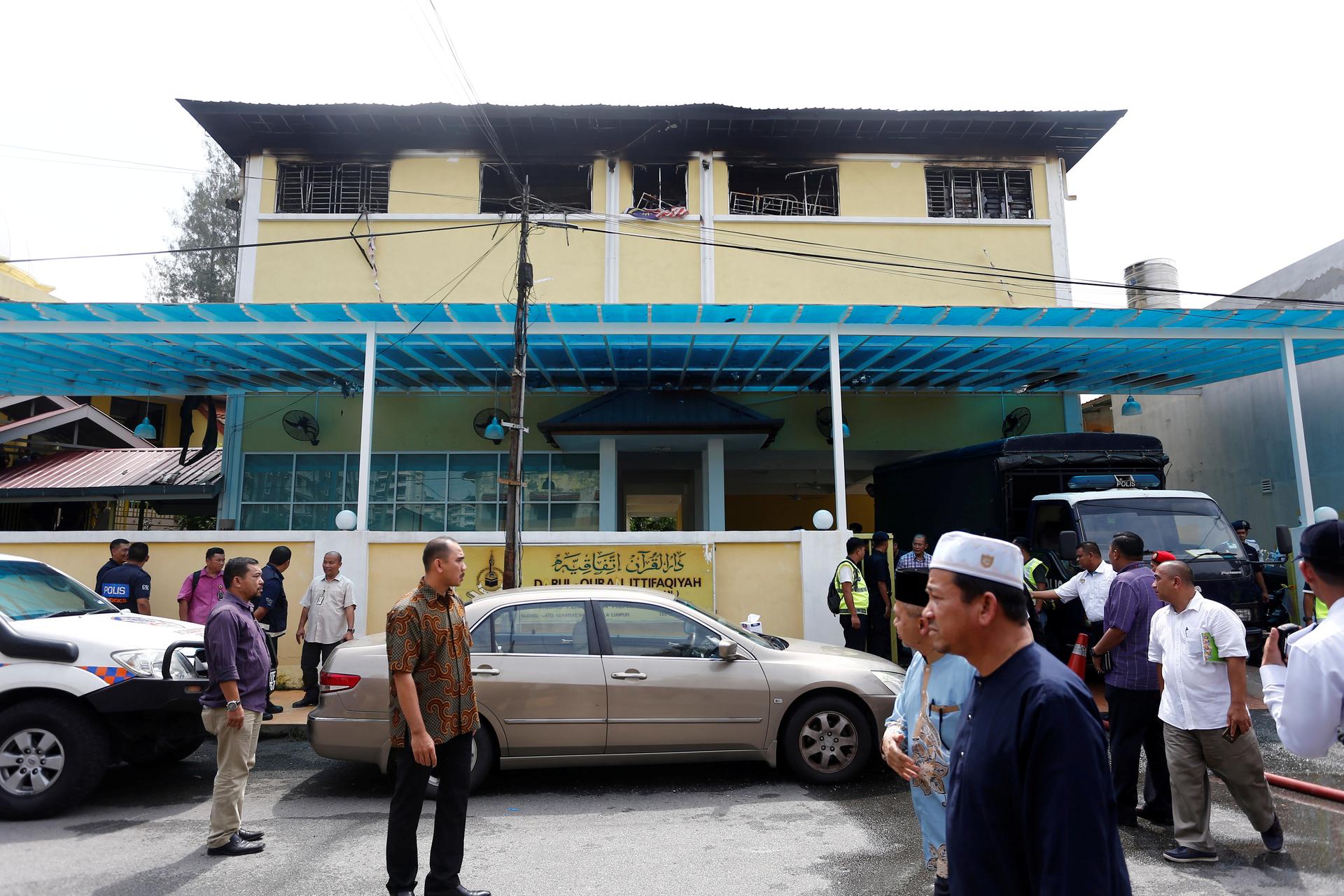 Malaysian court jails teenager for killing 23 people in school fire