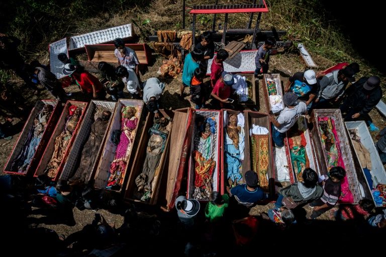 Digging up graves: an Indonesian community honours its dead