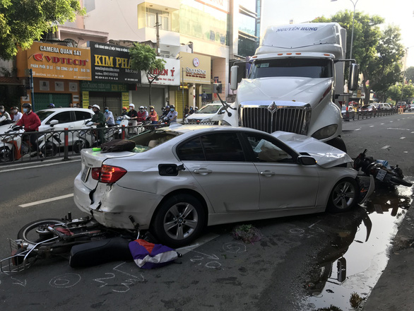 Three injured as tractor-trailer slams into car, motorbikes in Ho Chi Minh City