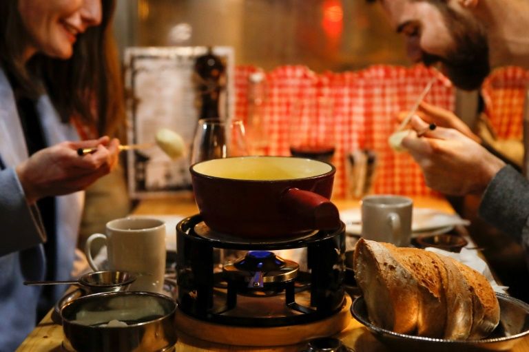 Swiss cheesed off over COVID-19 threat to fondue conviviality