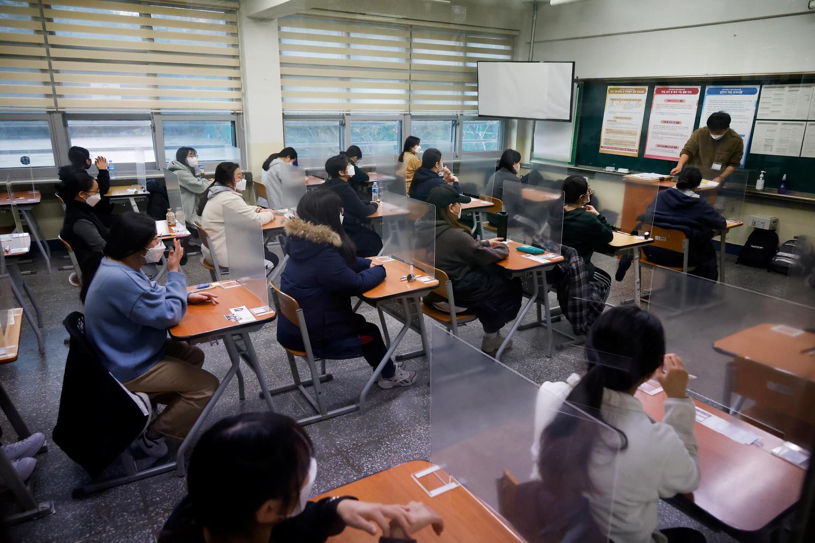 South Korea students sit college exam behind plastic barriers and in hospitals due to COVID-19