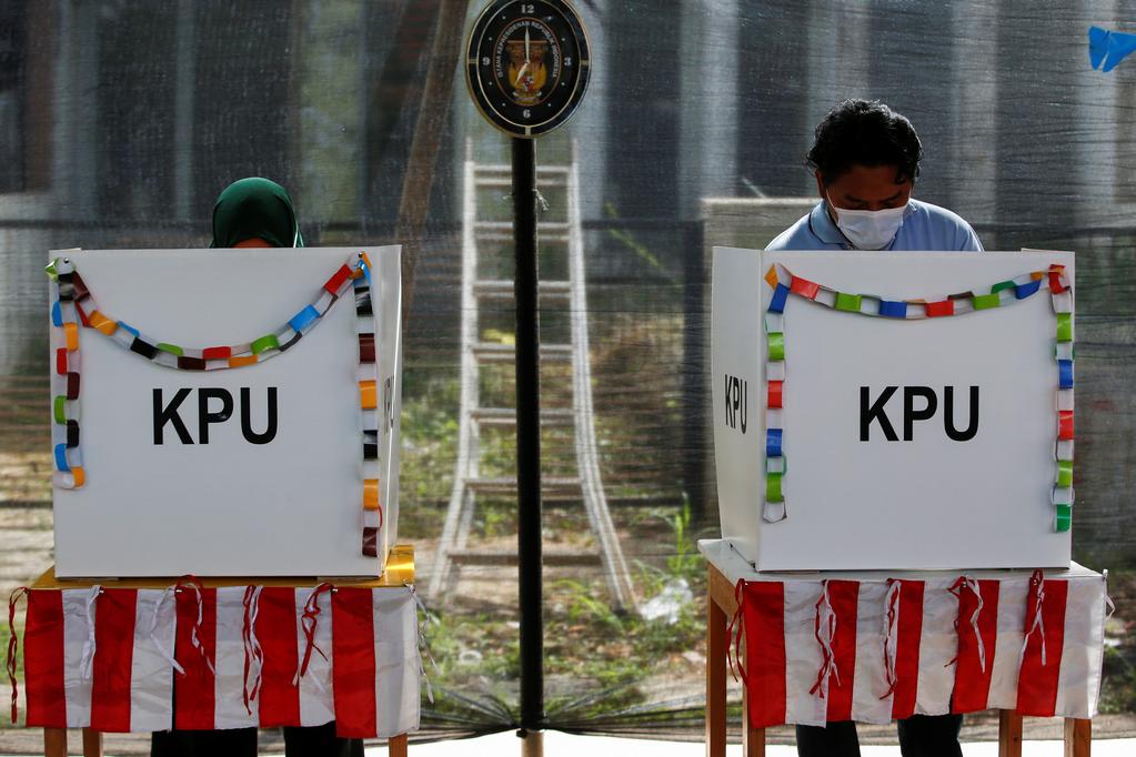 Indonesia holds regional polls under shadow of rising COVID-19 cases