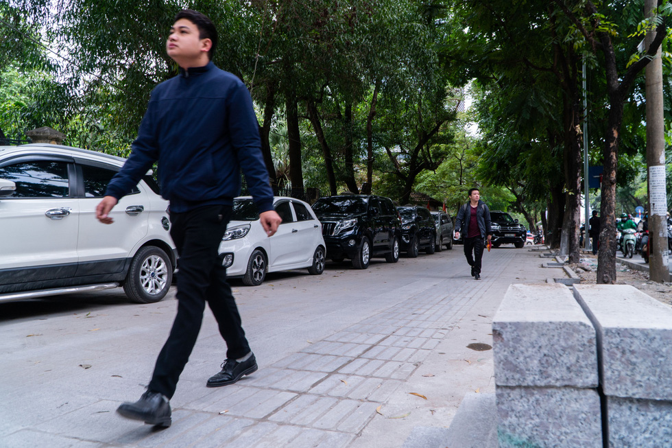 Hanoi sidewalks with projected 70-year lifespan poised for dilapidation by illegally parked cars