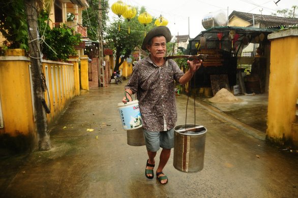 Buckets and a yoke: The last door-to-door water vendor in Vietnam's Hoi An