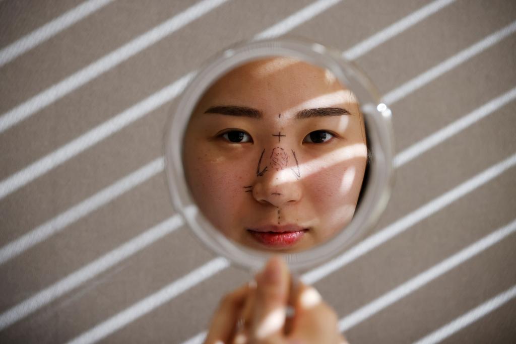 As end to pandemic mask-wearing nears, South Koreans scramble to arrange cosmetic surgery