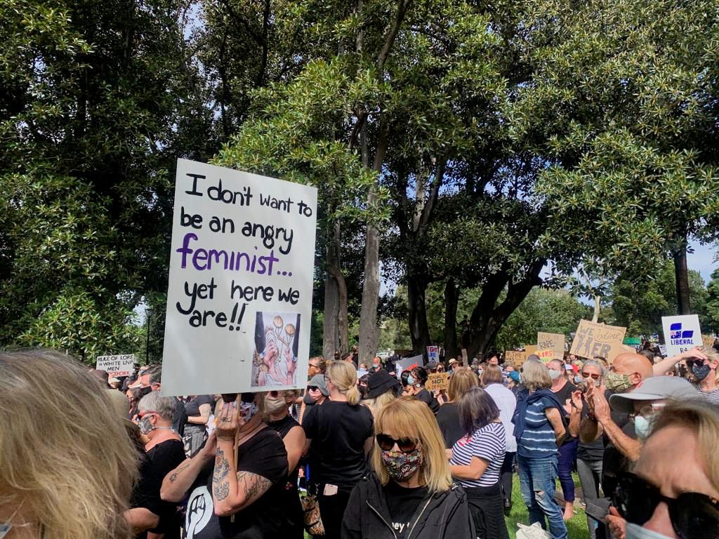 Black-clad women rally in Australia to demand gender violence justice