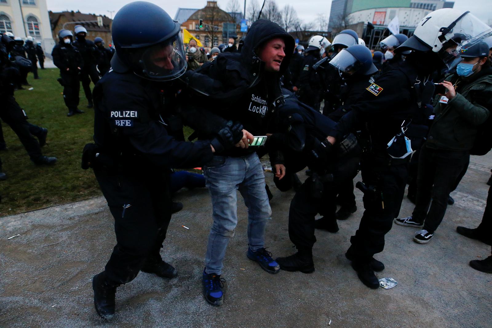 Police use water cannon as German lockdown protest turns violent