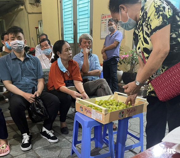Vietnamese police offer food, entertainment as queue for ID registration lasts till midnight