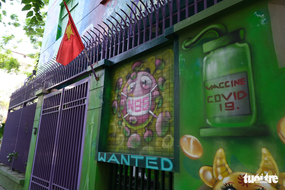 Artist paints murals on house to raise awareness of COVID-19 prevention in Hanoi