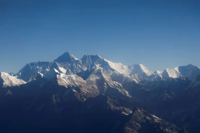 Exhaustion kills two Everest climbers, an American and a Swiss