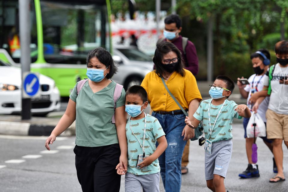 Singapore warns children susceptible to virus variants, shuts schools