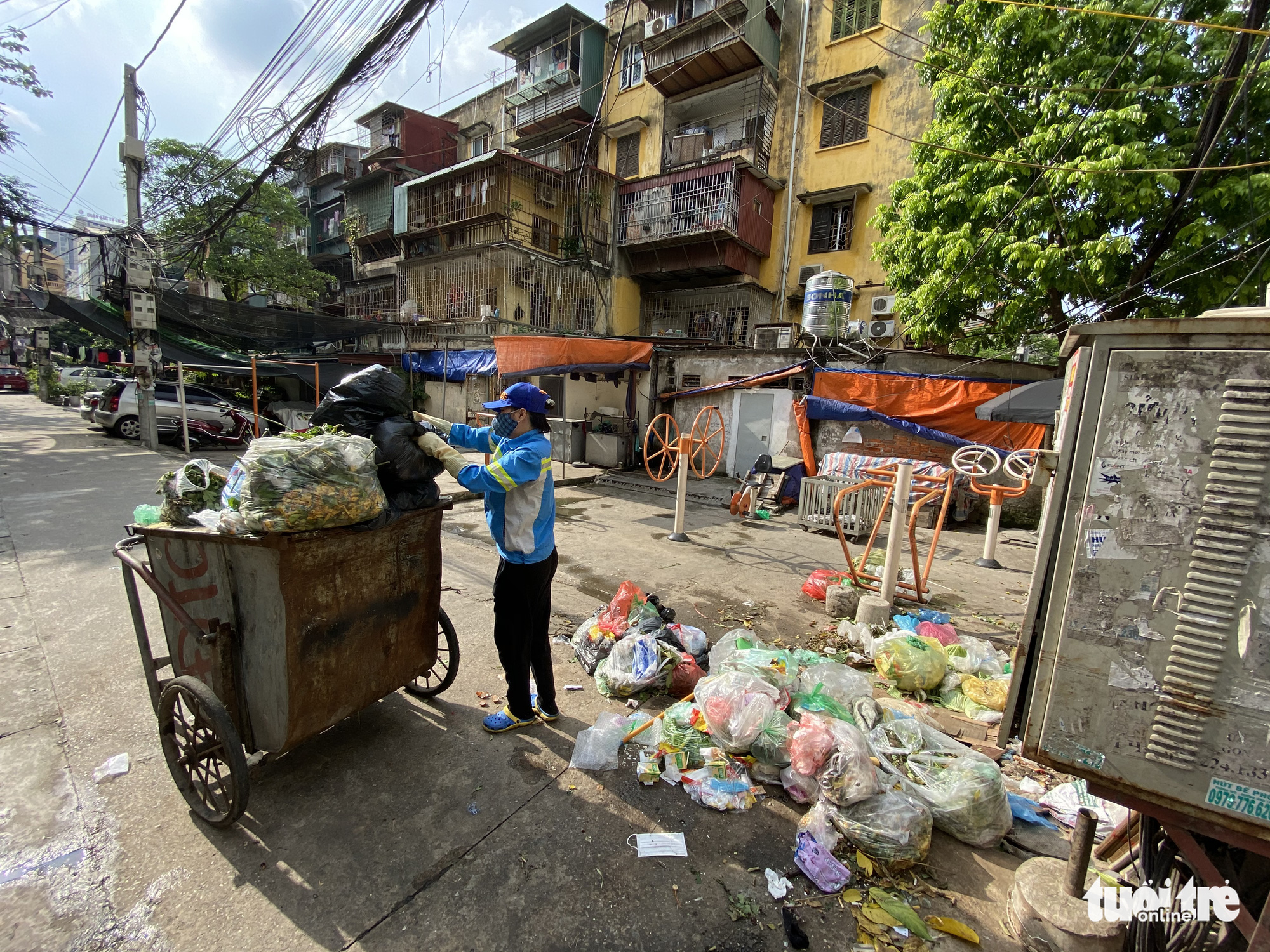 Unpaid sanitation workers take out loans, collect scrap to survive in Hanoi