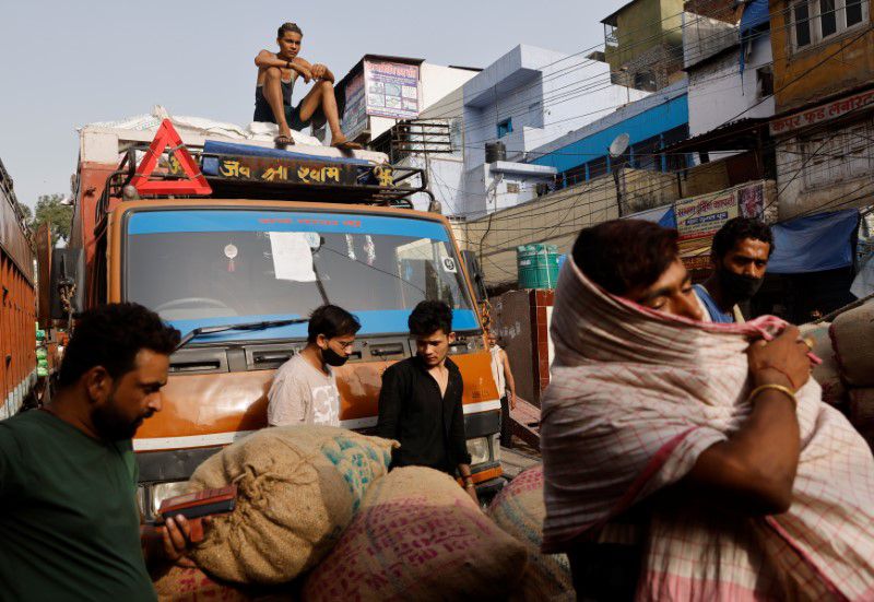 Alarm rises in India over COVID-19 risks as crowds return to malls and rail stations