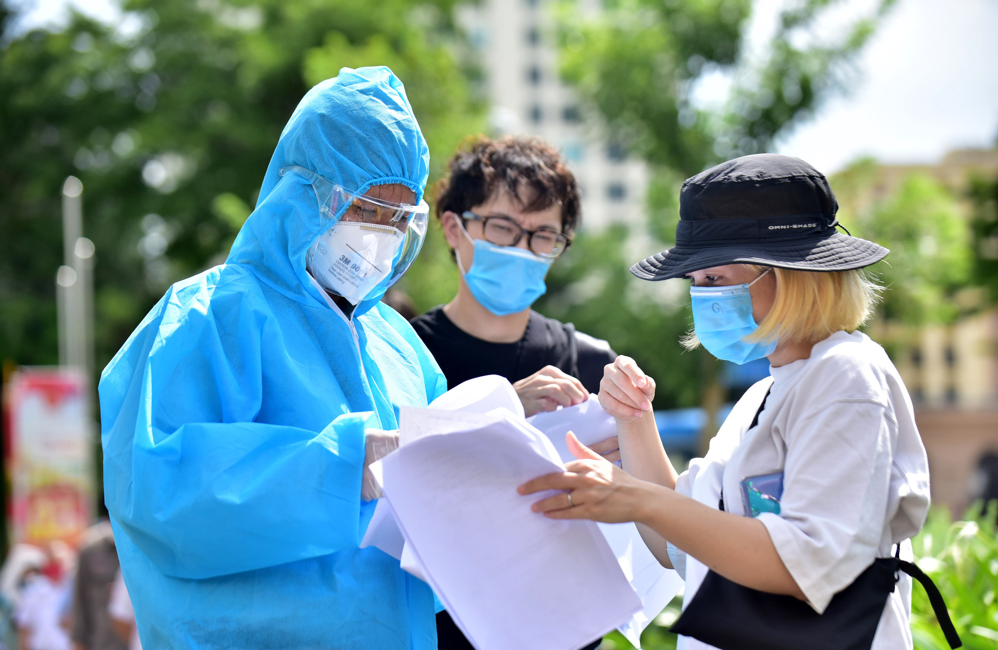 How can foreigners seek help during COVID-19 pandemic in Ho Chi Minh City?