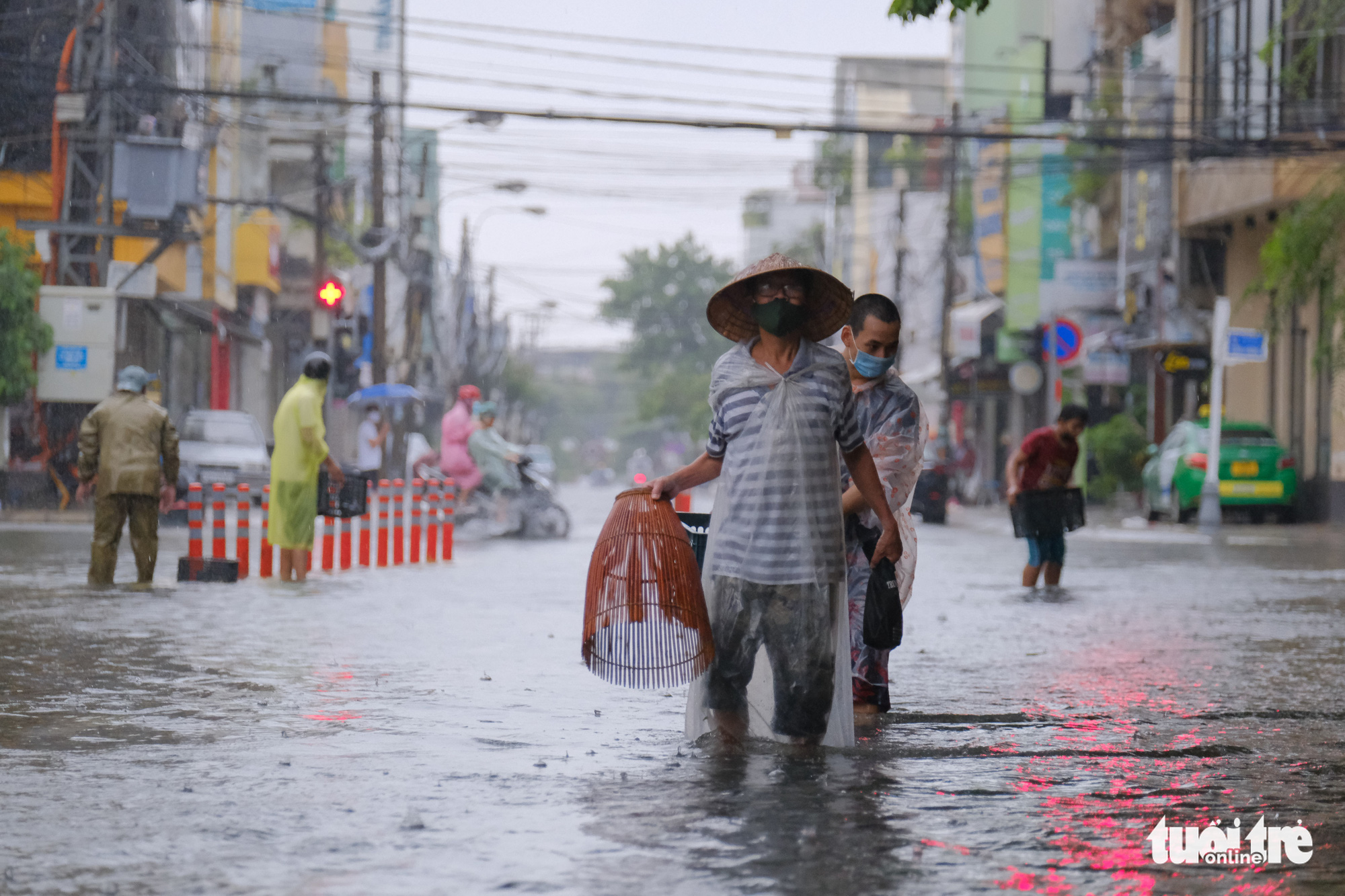 In Da Nang, people catch fish on deluged downtown streets