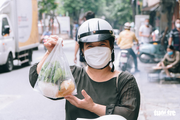 Hanoi dwellers return to local eateries as takeaway services reopen