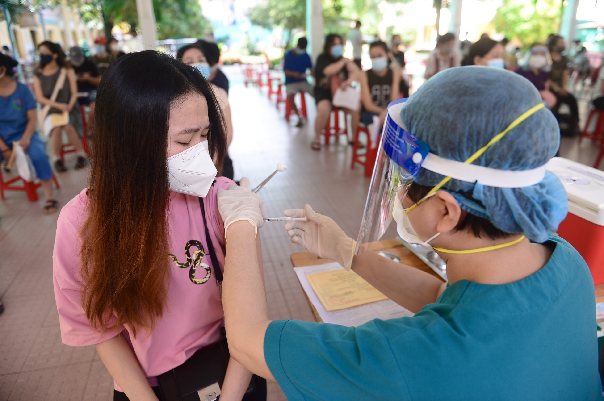 Why are many people still not vaccinated against COVID-19 in Ho Chi Minh City?