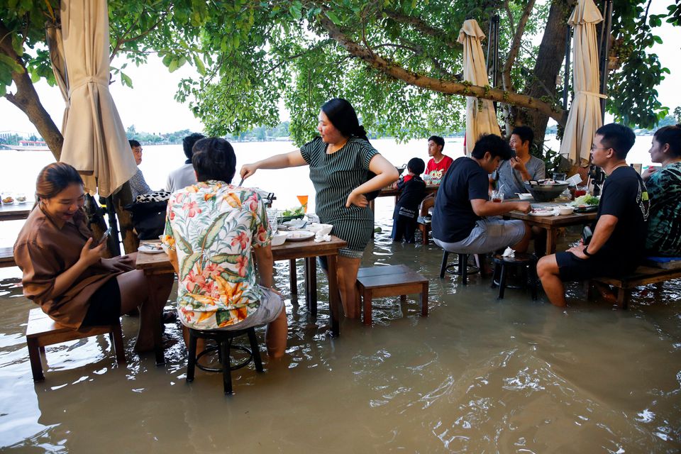 Riverside restaurant makes waves in Thailand as flood dining goes viral