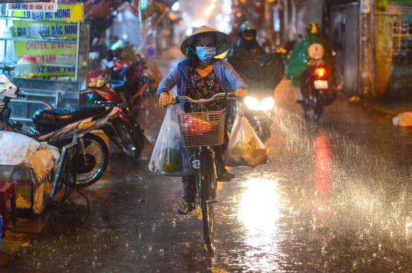 Streets of Ho Chi Minh City swamped as downpour hits