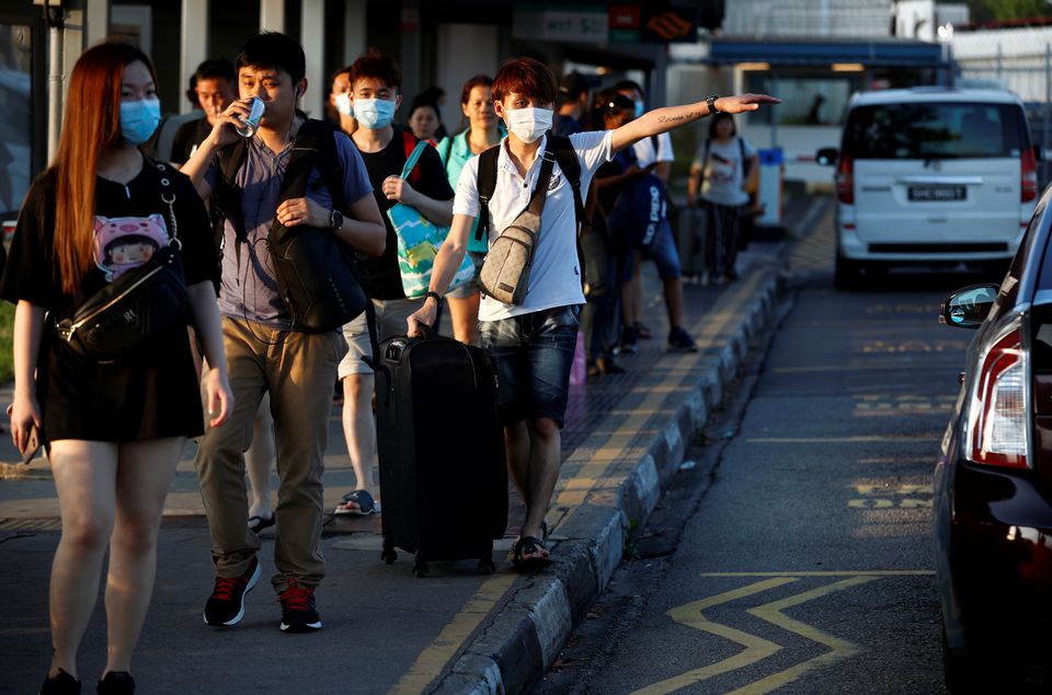 Singapore, Malaysia to open land border for vaccinated travelers