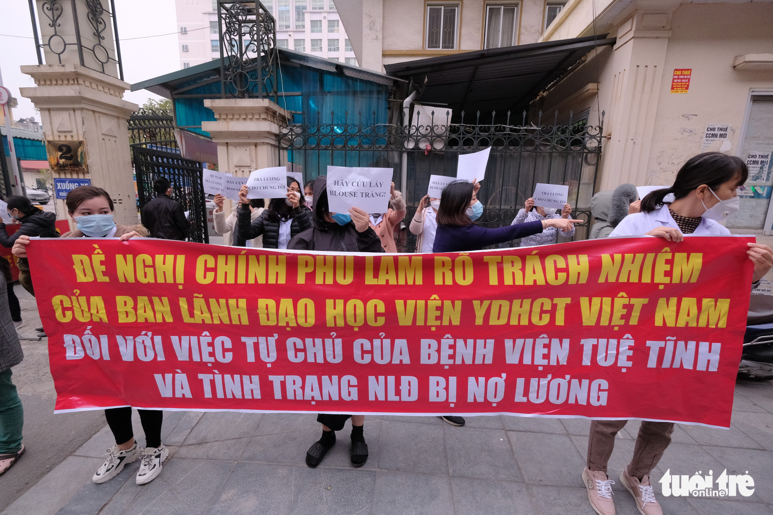 In Vietnam, doctors, nurses raise banners to demand 8-month unpaid salaries