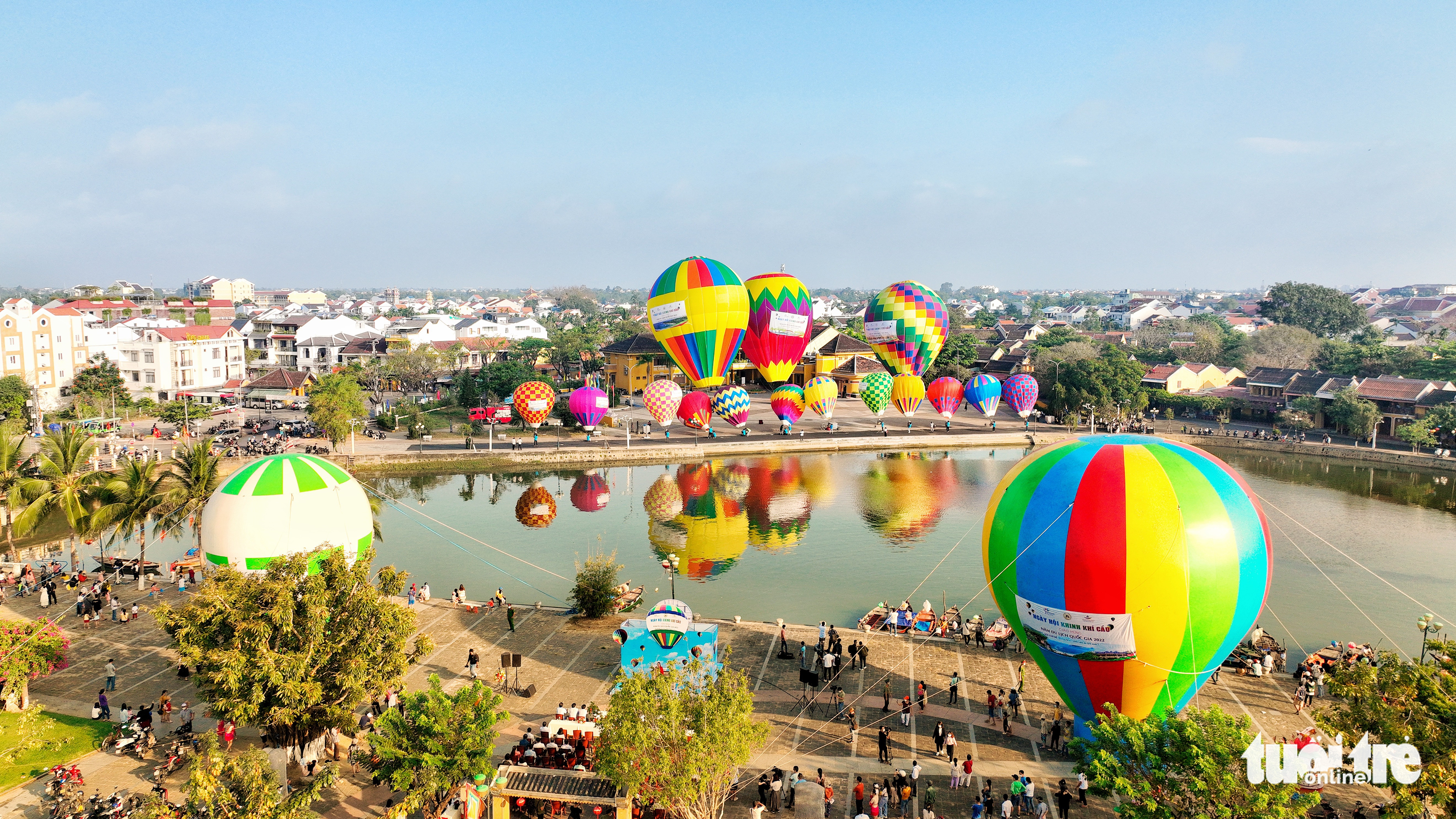 Hot-air balloons illuminate the sky above Hoi An's tourism