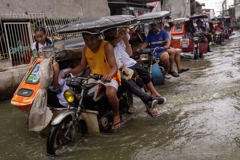 Philippines town gives taxis a lift as floods become norm