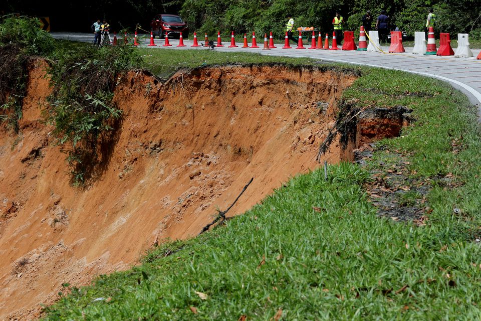 Malaysia landslide kills 12 at campsite, more than 20 missing