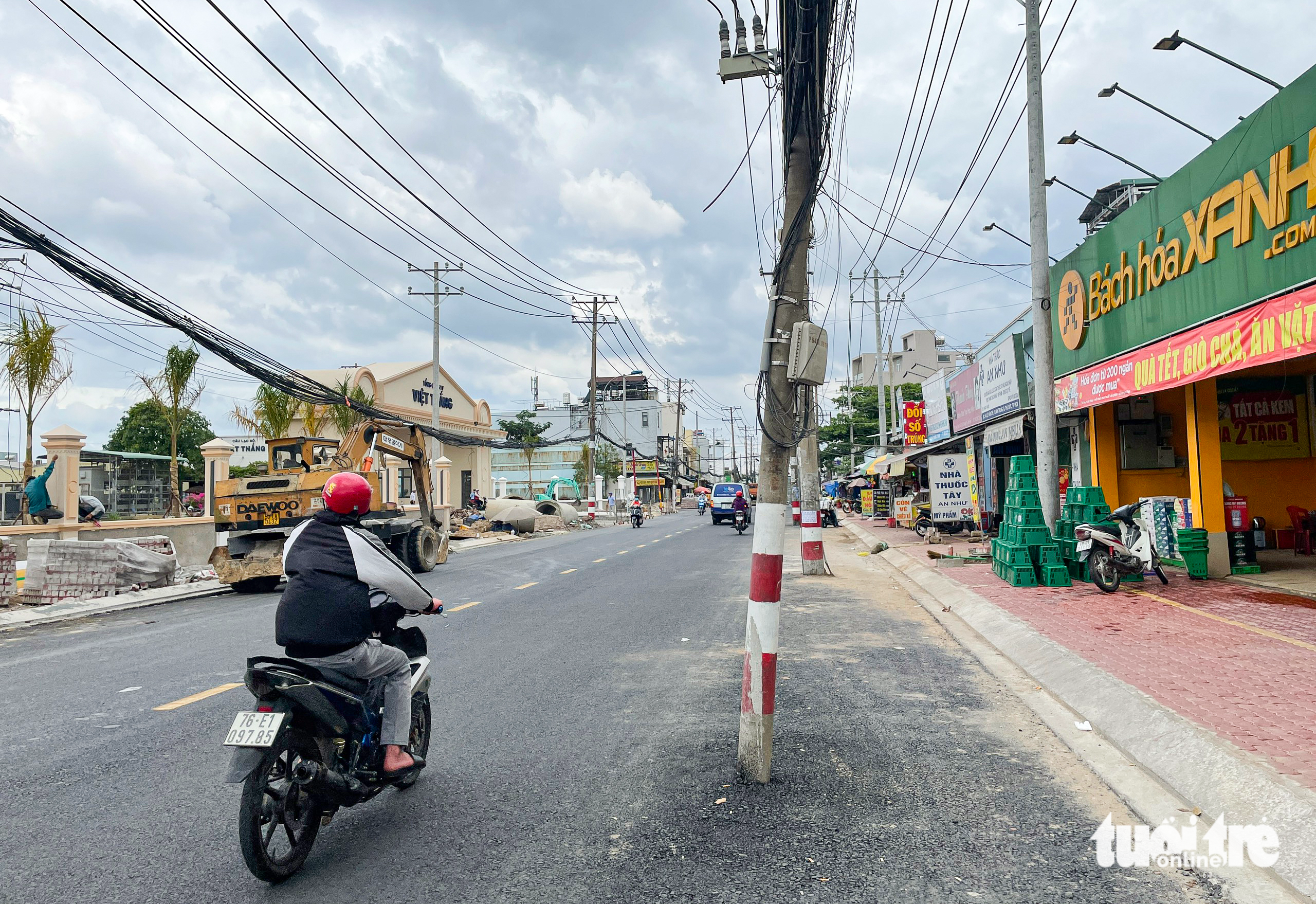 Dozens of power poles stand in the middle of Ho Chi Minh City street