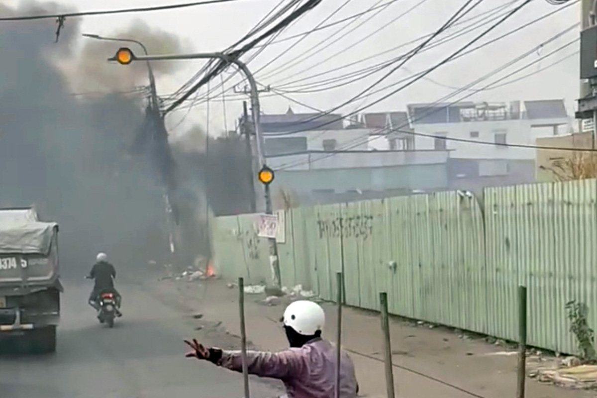 Trash burning fire hits utility pole, causes power outage in southern Vietnam