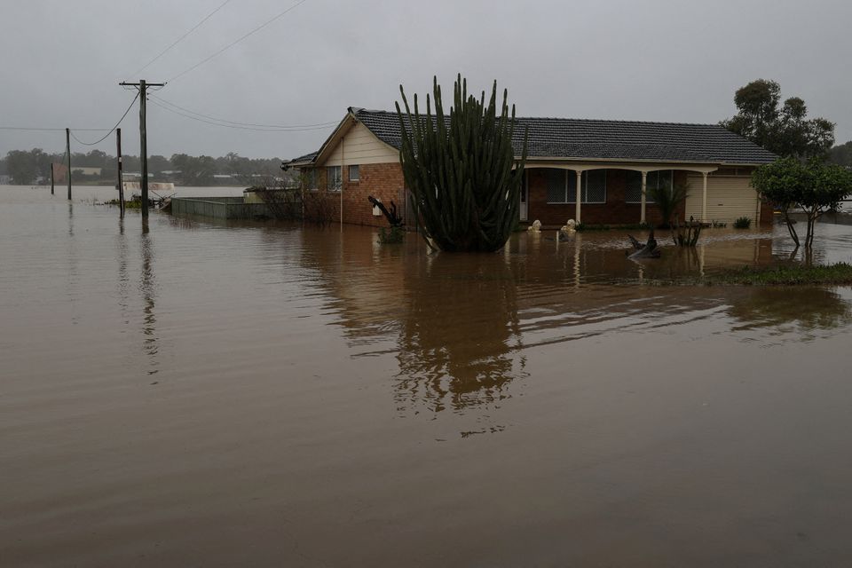 Heavy rain in Australia triggers flood evacuations in Queensland