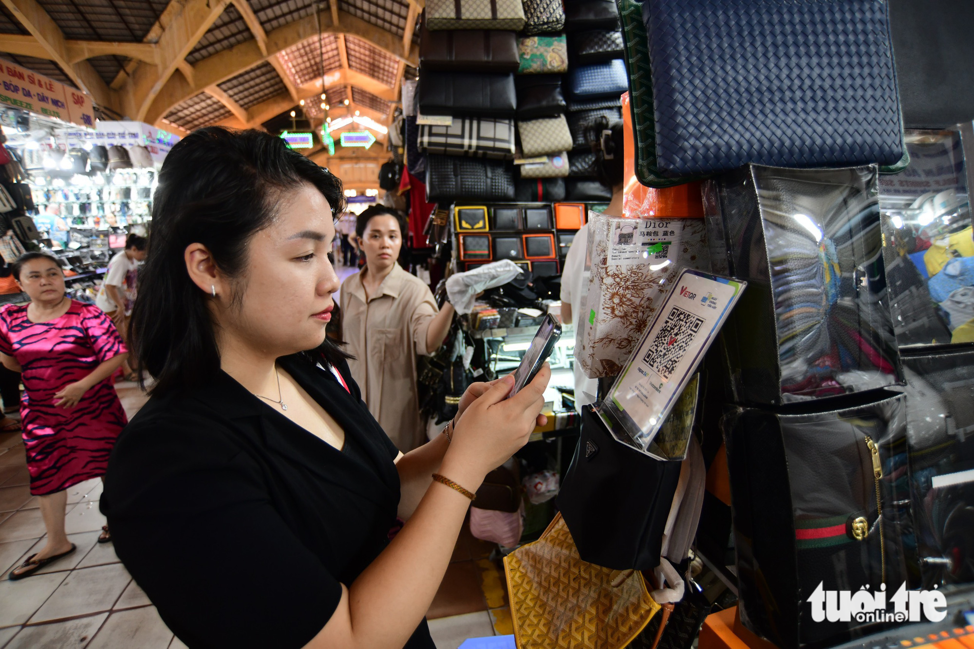 Market vendors in downtown Ho Chi Minh City embrace digital payments