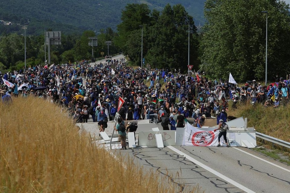 A dozen French police wounded in clashes with protesters opposing rail link in Alps